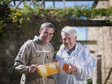 Beekeepers with honey comb and honey Stock Photo - Premium Royalty-Free, Code: 649-03566835
