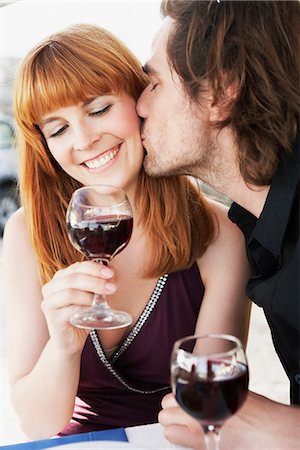 Man kissing woman on cheek Stock Photo - Premium Royalty-Free, Code: 649-03606093