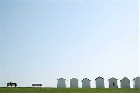 senior woman alone from behind - Beach huts in brighton Stock Photo - Premium Royalty-Free, Code: 649-03606683