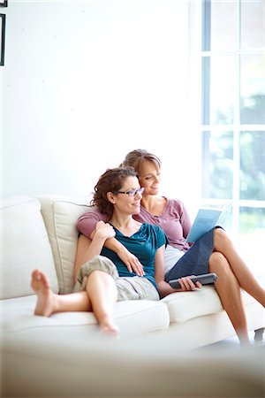 enjoying tv on couch - Same sex, lesbian lifestyle Stock Photo - Premium Royalty-Free, Code: 649-03621494