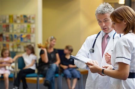 stethoscope girl and boy - Doctor and nurse in waiting area Stock Photo - Premium Royalty-Free, Code: 649-03621573