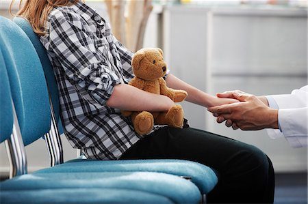 doctor and waiting room - Doctor holding young girls hand Stock Photo - Premium Royalty-Free, Code: 649-03621612