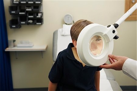 pediatrician examining boy - Doctor and young boy Stock Photo - Premium Royalty-Free, Code: 649-03621631