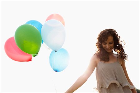 female holding balloons - Young woman holding air balloons Stock Photo - Premium Royalty-Free, Code: 649-03621759