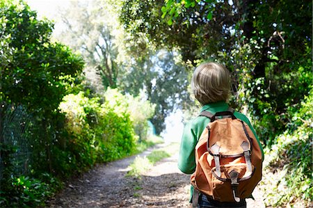 single blank bag - Boy with his backpack, walking Stock Photo - Premium Royalty-Free, Code: 649-03621913