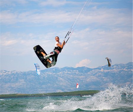 recreación - Kitesurfer jumping Foto de stock - Sin royalties Premium, Código: 649-03622039
