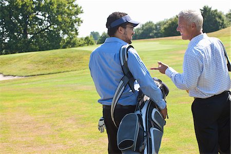 fun with black friends - Golfers talking during the game Stock Photo - Premium Royalty-Free, Code: 649-03622309