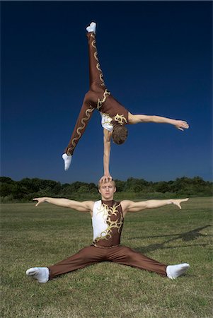 strong man costume - Acrobatic troop performing moves Stock Photo - Premium Royalty-Free, Code: 649-03622536