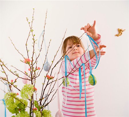 easter people - girl decorating twigs for easter Stock Photo - Premium Royalty-Free, Code: 649-03666646