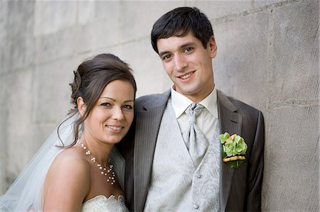 simsearch:649-06432579,k - Bridal couple smiling at the camera. Stock Photo - Premium Royalty-Free, Code: 649-03666850