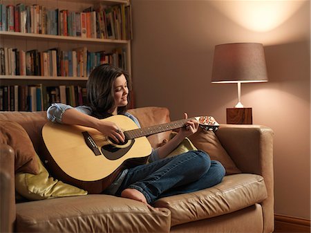 Girl, 14 playing guitar Stock Photo - Premium Royalty-Free, Code: 649-03667133