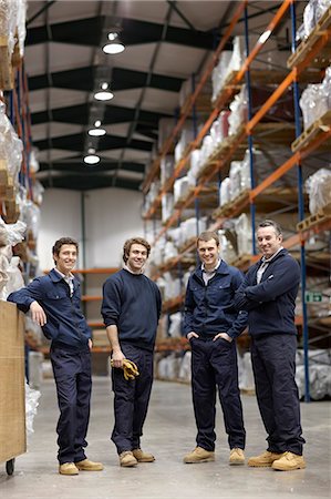 Workers in warehouse, smiling to camera Stock Photo - Premium Royalty-Free, Code: 649-03667178