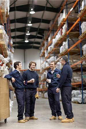 Workers in warehouse having break Stock Photo - Premium Royalty-Free, Code: 649-03667179