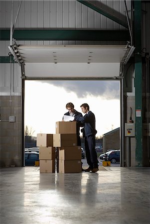 Two workers in warehouse Stock Photo - Premium Royalty-Free, Code: 649-03667188