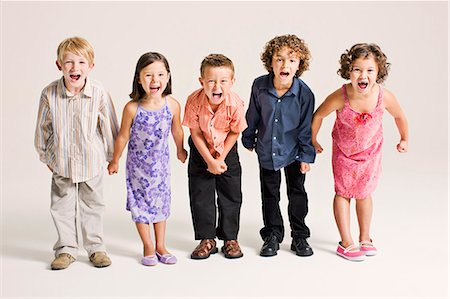 preteen boy happy white background - enfants criant Photographie de stock - Premium Libres de Droits, Code: 649-03667246