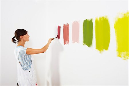 painting brush - Woman painting colour swatches on wall Stock Photo - Premium Royalty-Free, Code: 649-03667443