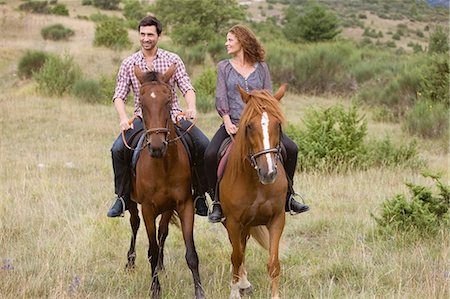 recreational horseback riding - Couple riding horses Stock Photo - Premium Royalty-Free, Code: 649-03769011