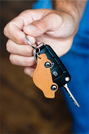 Hand holding car keys Stock Photo - Premium Royalty-Free, Code: 649-03769171