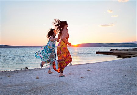 people at beach fashion picture - Women running at the beach Stock Photo - Premium Royalty-Free, Code: 649-03769768