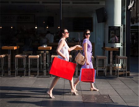 friends sidewalk walk - Young women shopping Stock Photo - Premium Royalty-Free, Code: 649-03769812