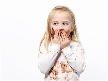 embarrassed - Girl playing with chocolate sauce Stock Photo - Premium Royalty-Free, Code: 649-03774382