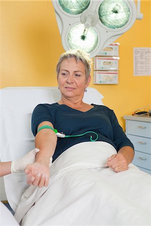 female nurse with gloves - Patient on couch waiting for injection Stock Photo - Premium Royalty-Free, Code: 649-03774440