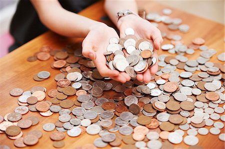 simsearch:649-06717474,k - Girl holding coins in her hands Stock Photo - Premium Royalty-Free, Code: 649-03774580