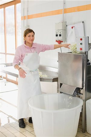 food processing aprons - Production assistant Stock Photo - Premium Royalty-Free, Code: 649-03774814