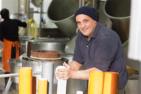 Artisan bison mozzarella production Stock Photo - Premium Royalty-Free, Code: 649-03774811