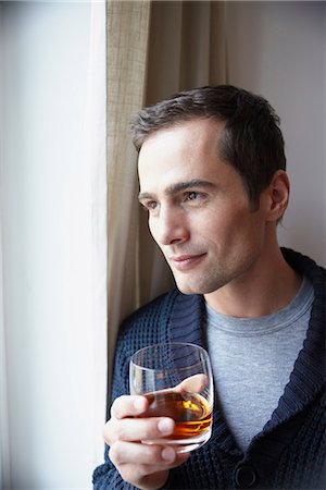 people drinking whiskey - Man holding glass of whiskey Stock Photo - Premium Royalty-Free, Code: 649-03774859