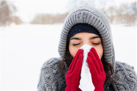 sneeze cold - Woman using tissue Stock Photo - Premium Royalty-Free, Code: 649-03774921