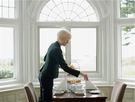 restaurant service - Woman setting up table Stock Photo - Premium Royalty-Free, Code: 649-03775176