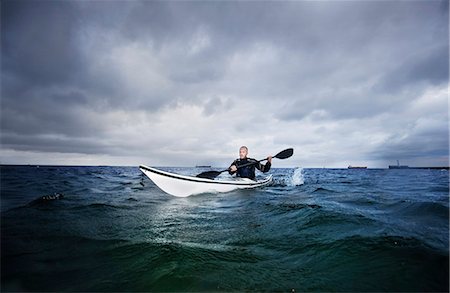 sports and kayaking - Man in kayak Stock Photo - Premium Royalty-Free, Code: 649-03775551