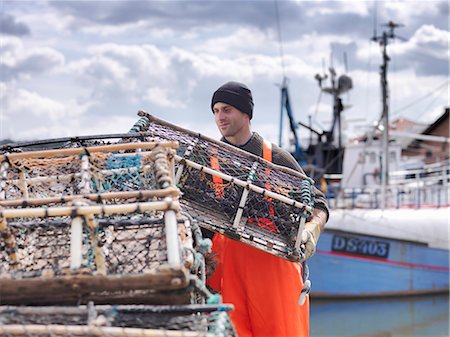 fishermen - Fisherman loading lobster pots Stock Photo - Premium Royalty-Free, Code: 649-03770321