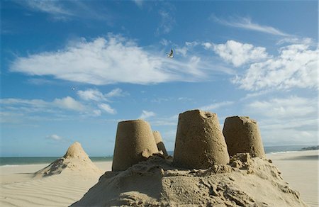 Sand castles under blue sky Stock Photo - Premium Royalty-Free, Code: 649-03770539