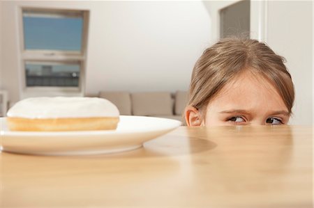 food cravings - LIttle girl wants a piece of cake Stock Photo - Premium Royalty-Free, Code: 649-03770676