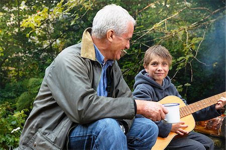 food grand father - Grandfather and grandson by campfire Stock Photo - Premium Royalty-Free, Code: 649-03770831