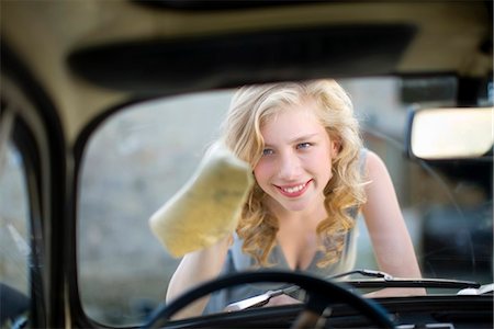 Woman cleaning her car Stock Photo - Premium Royalty-Free, Code: 649-03771058