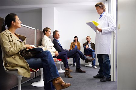 Doctor calling a patient in waiting room Stock Photo - Premium Royalty-Free, Code: 649-03771564