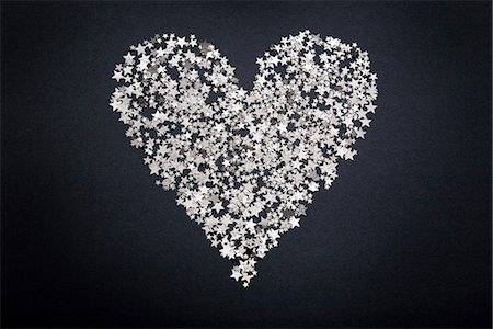 sparkling - Heart shape figure made of small stars Foto de stock - Sin royalties Premium, Código: 649-03771713