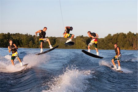 exhilarating - Wakeboarder performing 360 trick Stock Photo - Premium Royalty-Free, Code: 649-03771750