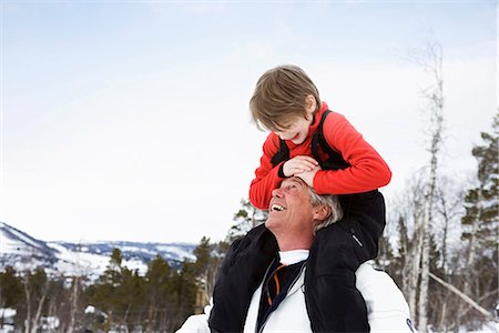 senior man carrying kid - Grandson and grandfather smiling Stock Photo - Premium Royalty-Free, Code: 649-03772148