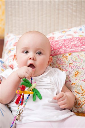 Baby sitting on bed Stock Photo - Premium Royalty-Free, Code: 649-03772162