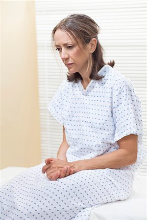 forlorn older woman - Patient on examination table Stock Photo - Premium Royalty-Free, Code: 649-03772263