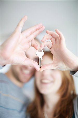 A happy couple holding a key Stock Photo - Premium Royalty-Free, Code: 649-03772826