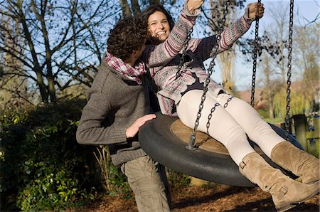 romantic relationship swings images - Couple on swing Stock Photo - Premium Royalty-Free, Code: 649-03773399