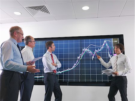 Business meeting with graphs on screen Stock Photo - Premium Royalty-Free, Code: 649-03773544