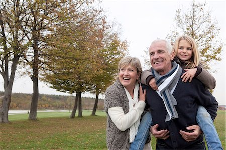 retirement outdoors - Grandparents and granddaughter in autumn Stock Photo - Premium Royalty-Free, Code: 649-03773966