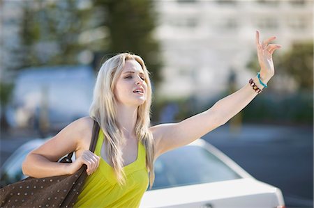 Woman calling a cab Stock Photo - Premium Royalty-Free, Code: 649-03796178
