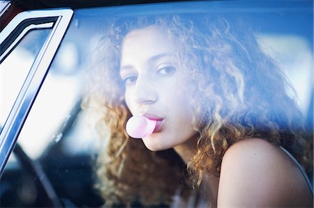 side window car - Woman chewing a gum Stock Photo - Premium Royalty-Free, Code: 649-03796170